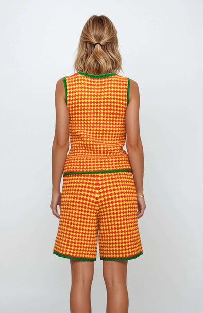 Back view of a colorful 2-piece knit set for women featuring a checkered tank top and shorts in yellow, red, and green.