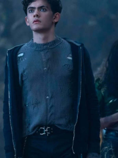 Distressed Agatha All Along Joe Locke sweater in a punk outfit, featuring holes and embroidery details.