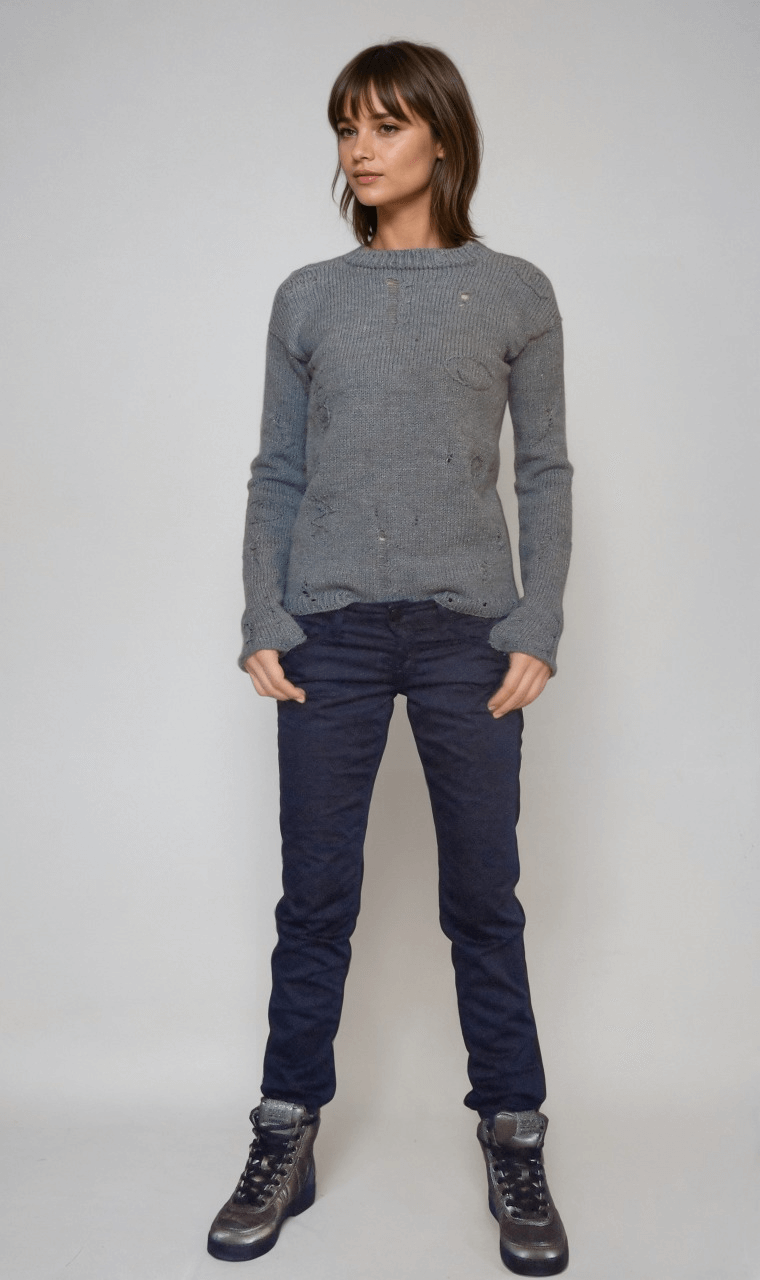  agatha all along teen sweater .cable knit sweater in grey worn by a model, styled with dark jeans and boots, inspired by punk aesthetics.