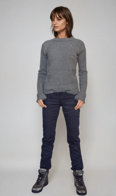  agatha all along teen sweater .cable knit sweater in grey worn by a model, styled with dark jeans and boots, inspired by punk aesthetics.