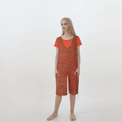 Knitted  jumpsuit shorts with v-neck and pockets in vibrant color gradient, featuring tie details and relaxed fit for streetwear style.