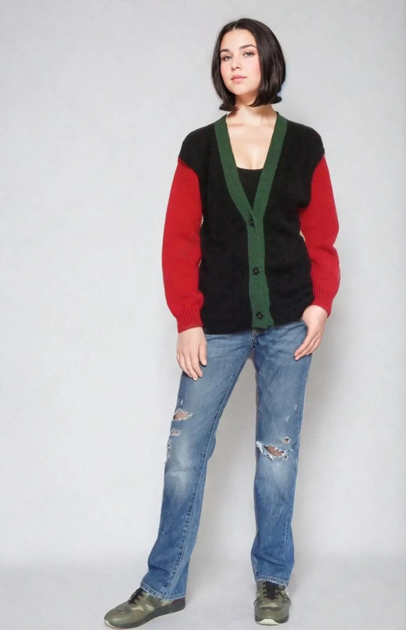Handmade color block sweater inspired by Twin Peaks, featuring a V-neck and relaxed fit, styled with distressed jeans.