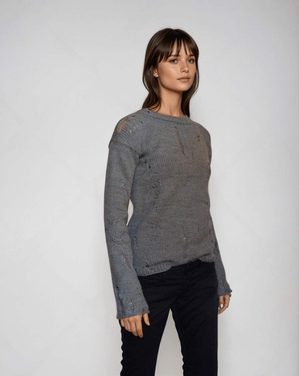 Distressed punk sweater inspired by Agatha Harkness, featuring cable knit design and embroidered details, handmade in grey.