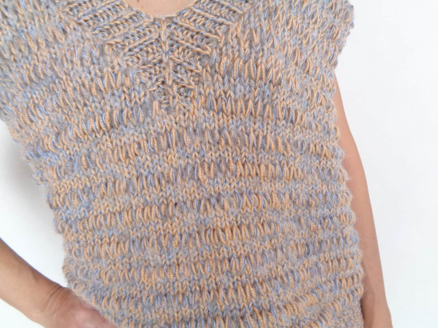 Alpaca blend sweater vest in multicolor, knitted from soft alpaca yarn, with a cozy V neck and chunky knit design.