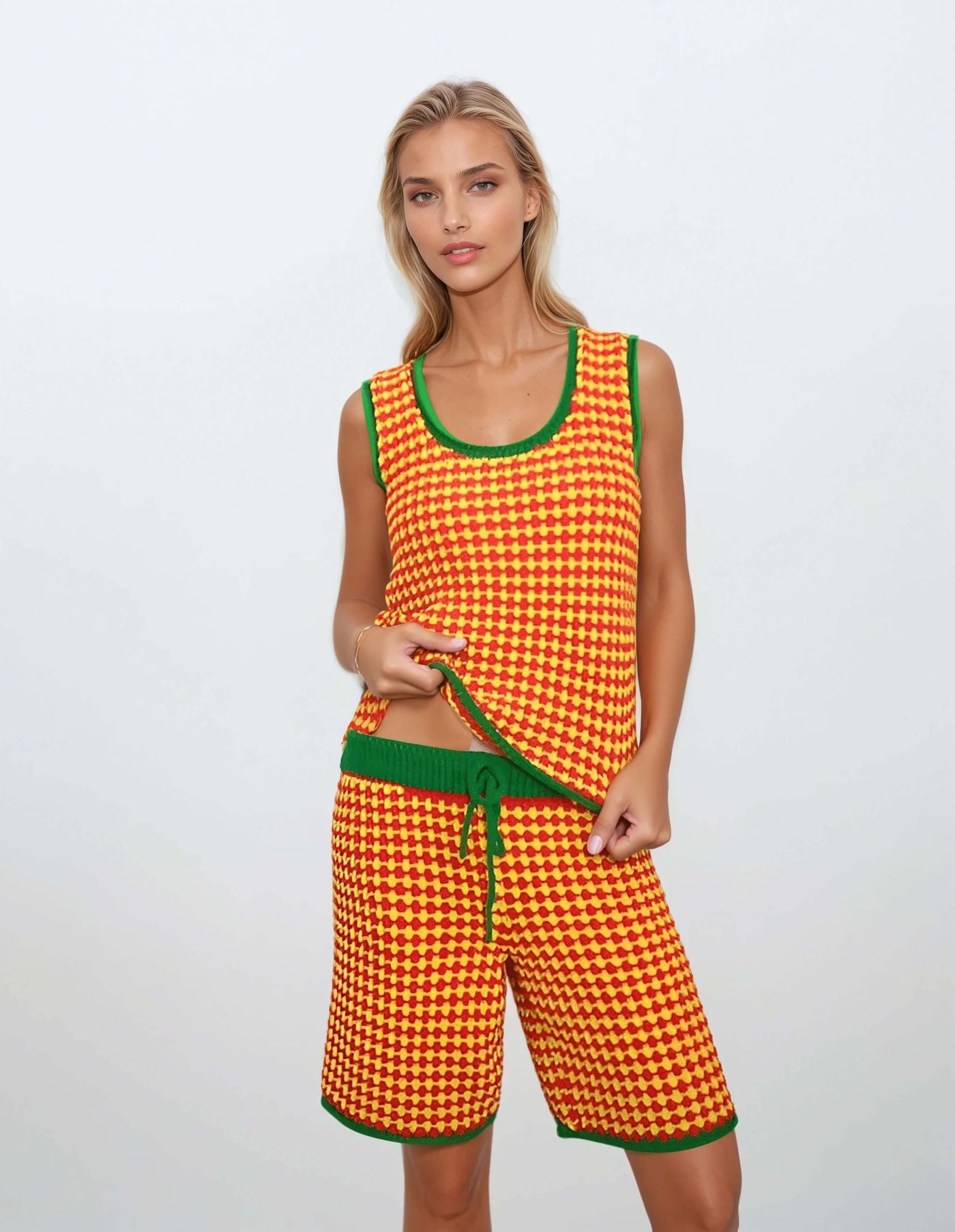 Colorful 2-piece knit set for women featuring a checkered tank top and shorts in yellow, red, and green for summer festivals.