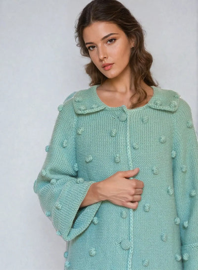 Turquoise knitted cardigan with bubble texture, showcasing a woman wearing a lightweight mohair cardigan.
