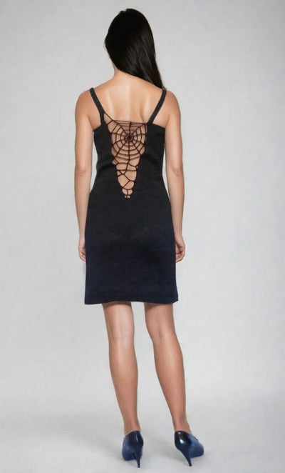Back view of a black spiderweb design dress with spaghetti straps, featuring an open back and form-fitting silhouette.
