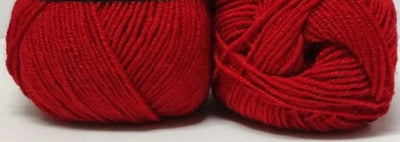 Red yarn balls suitable for knitting and crafting, ideal for warm and vibrant projects.