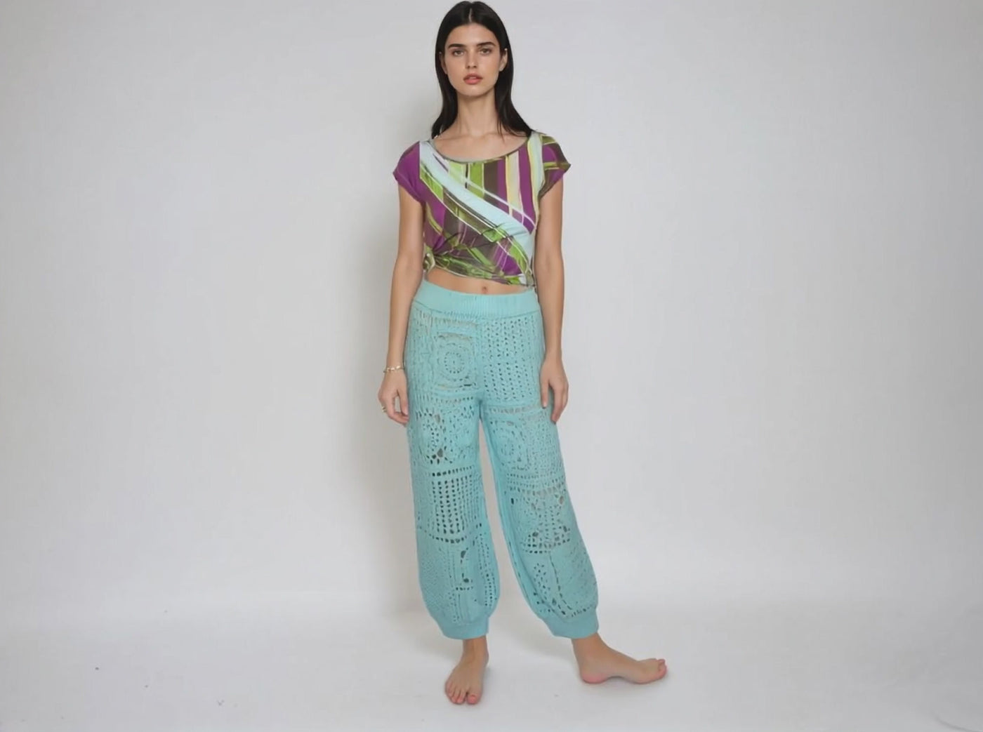 Turquoise high waisted harem pants with crochet granny square pattern, styled in a boho look.