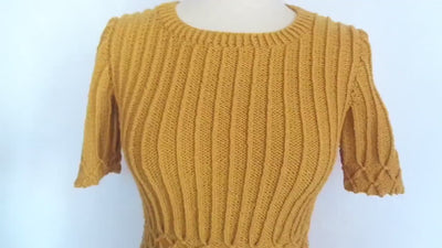 Handmade Bonnie and Clyde sweater in mustard yellow, featuring intricate cable knit design and short sleeves.
