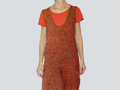 Vibrant knitted short jumpsuit romper with pockets, featuring a red and green ombre style, V-neck, and relaxed fit.