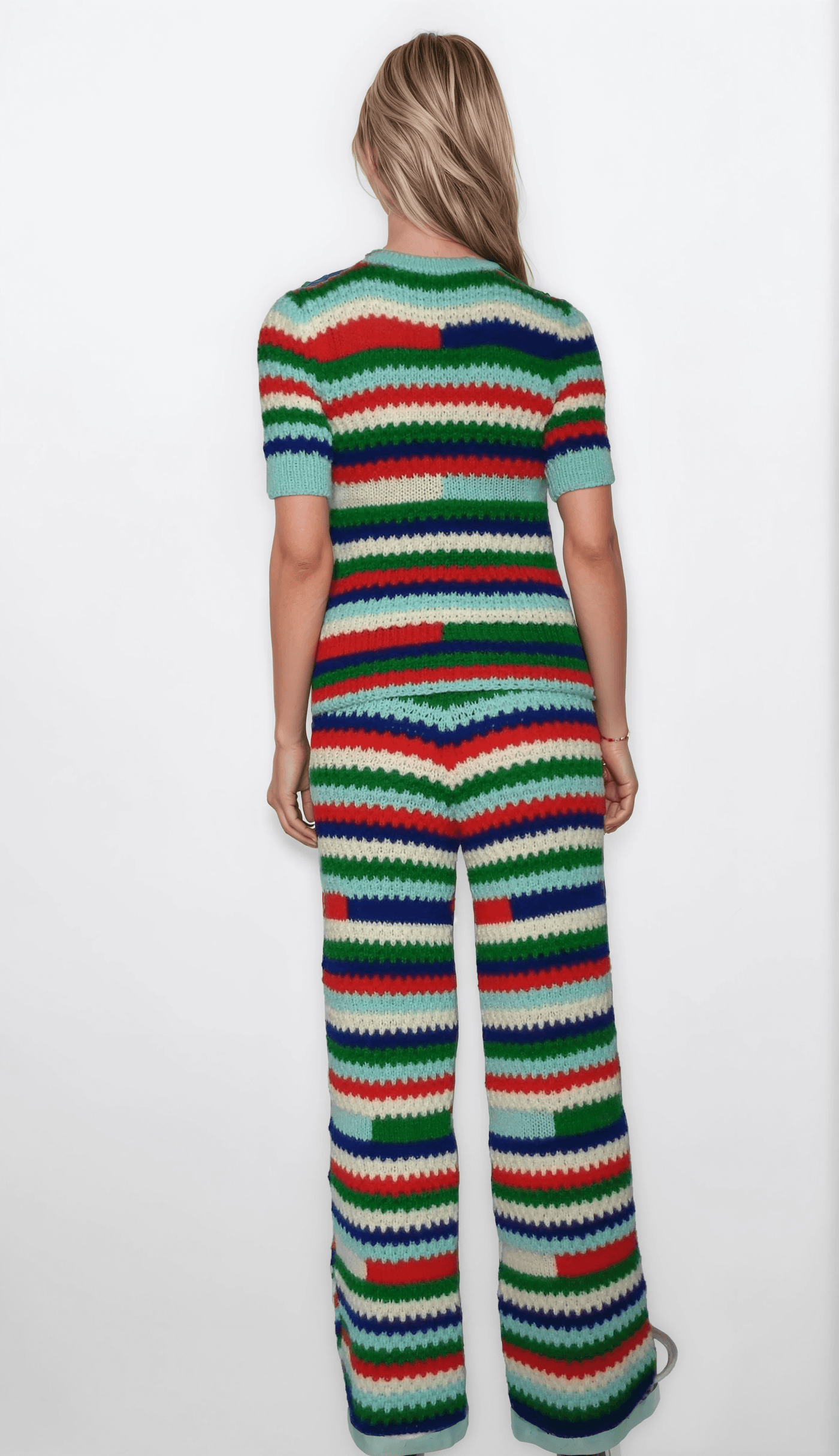 Back view of a multicolor striped two-piece pants set for women, featuring a hand-knit crochet design.
